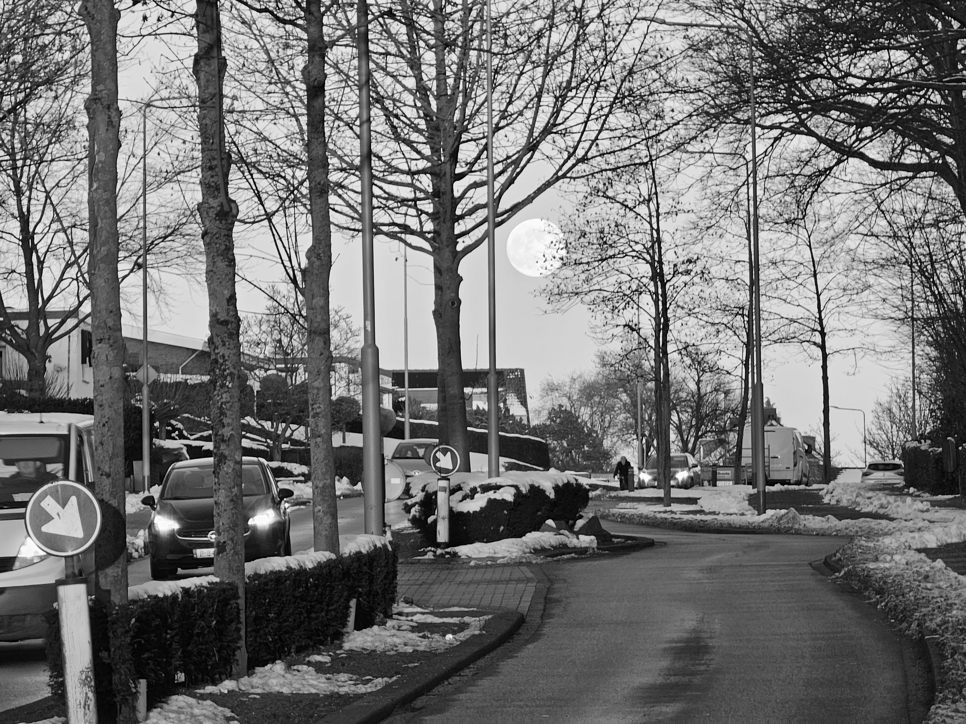 Photo showing the Full Moon illuminating the Way of Commuters travelling Home.