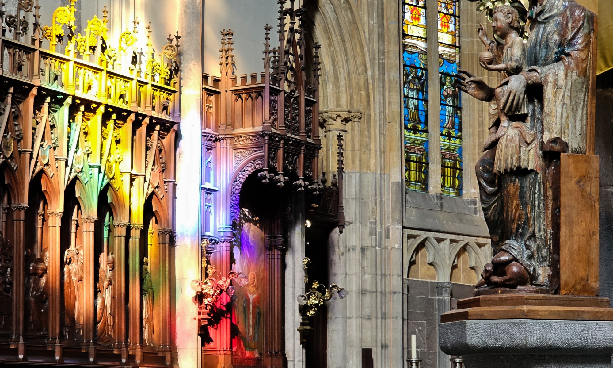 Sun is shining through one Window in the Cathedral of Liège: the Sunlight is visible as Eye of God on the Choir